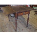 A Victorian oak single drawer Pembroke table on turned supports.