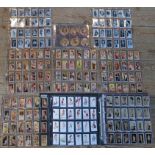 A folder containing an extensive collection of cigarette cards,