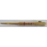 Sampson Morden, a yellow metal and enamel propelling pencil ,