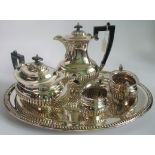 A four piece silver plated tea set and tray.