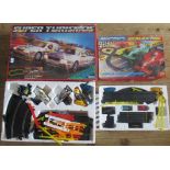A Super Turismos Racing Car Set, together with a Micro Scalextric Racing Set.