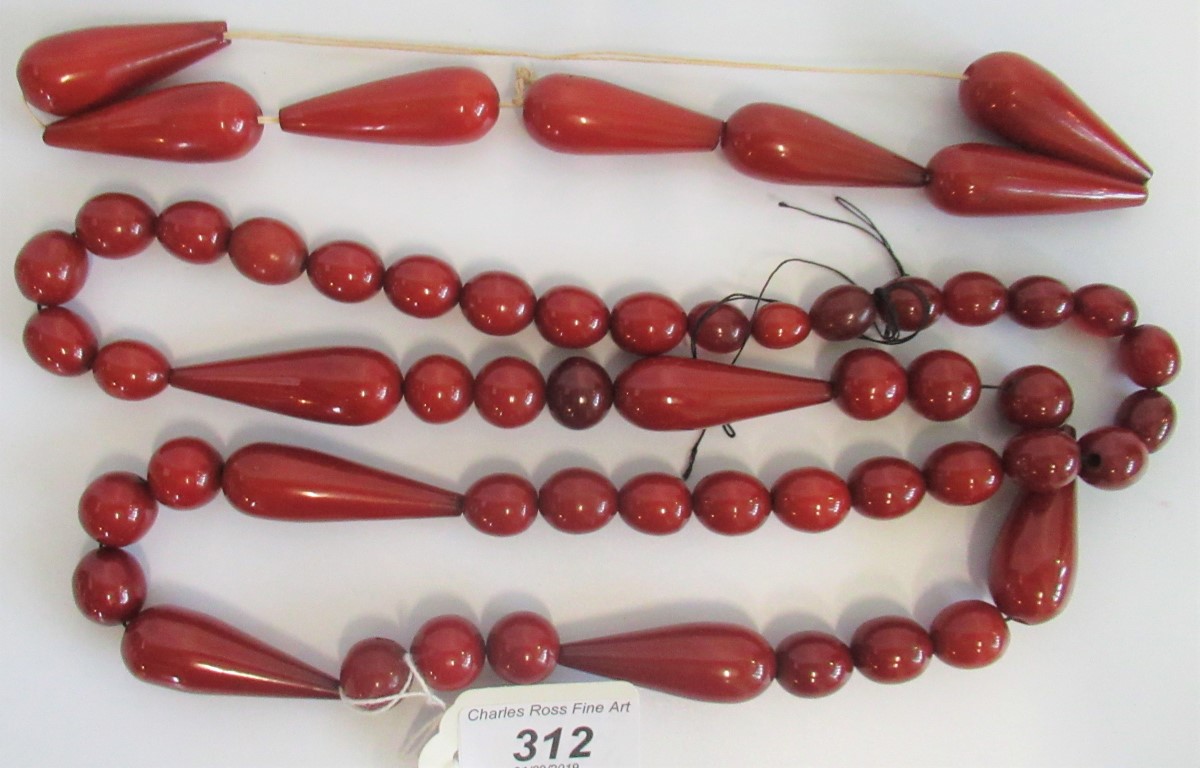 An amber bead long chain, composing circular oval and elongated tier drop beads,