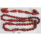 An amber bead long chain, composing circular oval and elongated tier drop beads,