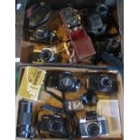 Two boxes containing a collection of vintage SLR and other cameras, to include: Nikkormat SLR,