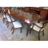 A mahogany Victorian-style wind-out dining table,
