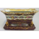 A 19th century Jacob Petit porcelain bulb planter and stand, with gilt purple and floral decoration,