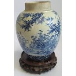 A 19th century Chinese blue and white ginger jar on associated wooden stand.