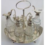 An 18th century hallmarked silver 7 bottle cruet on stand.