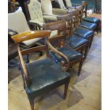 A 19th century mahogany scroll arm carver chair together with four associated single dining chairs