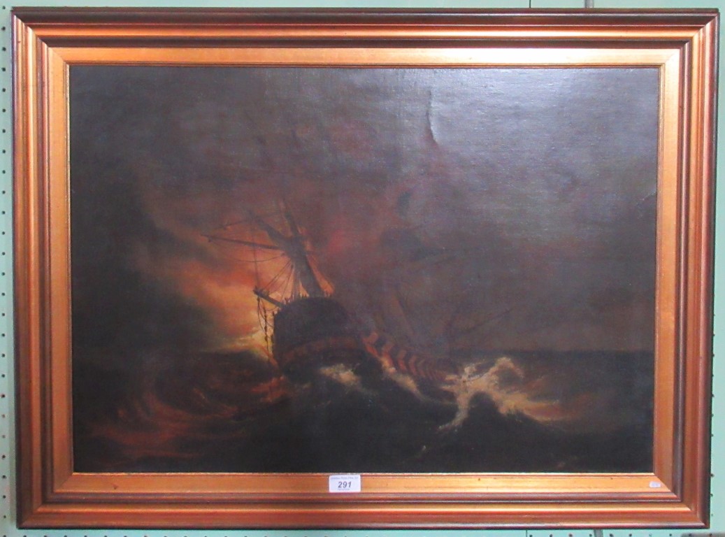 A 19th century gilt framed oil on canvas depicting a galleon in stormy seas in the manner of