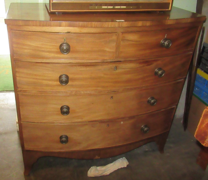 A Victorian mahogany bow front chest of two short over three long graduated draws.