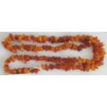 An Amber necklace of rustic form, comprised of various colour shades and opacity.