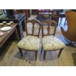 A pair of Edwardian dining chairs.