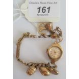 A 9ct gold ladies cocktail watch together with 6 gold charms.