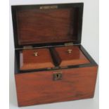 A mahogany tea caddy.