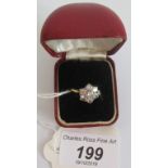 A seven stone diamond cluster ring,