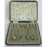 A cased set of six early 20th century coffee spoons and sugar tongs, Sheffield 1926.