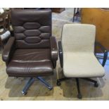 Two swivel office chairs.