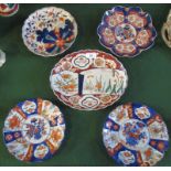 A collection of five 19th century Imari dishes, typically decorated in the Oriental palette,