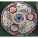 A large 19th century Imari charger, the Oriental decoration depicting deer,