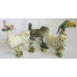 A collection of three Beswick cats, together with four Beswick birds, comprising: pair of Blue Tits,