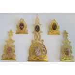 A collection of gilt brass and agate book embellishments.