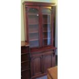 A Victorian mahogany cupboard bookcase. Condition Report: 212cms high.