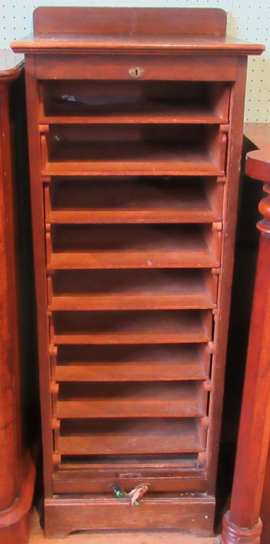 An oak tambor fronted filing cabinet.