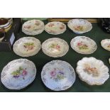A collection of nine florally decorated ribbon plates, associated tazza,