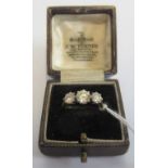 A three stone half hoop diamond ring,