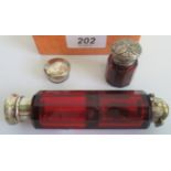 Two ruby glass perfume bottles. Condition Report: Large bottle has broken top.