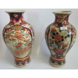 A pair of early 20th century oriental vases with floral decoration in the Imari palette