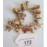 A 9ct gold charm bracelet comprising approximately 15 charms to include rugby ball, wine bottle,