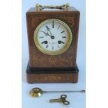 An Edwardian rosewood and inlaid mantle clock bearing the name H.Marr, Paris.