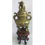 An impressive 20th century brass incense burner with Dog of Fo lid surmounted by two mythical