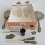 A box containing a quantity of miscellaneous hallmarked silver items to include mirror, brush,