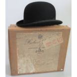 A bowler hat in original box, bearing the label Herbert Johnson, 38 New Bond Street, London.
