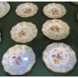 A set of six Meissen side plates, with gilt and central floral decoration on a cream ground.