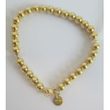 A Tiffany and Co. 18ct gold bead bracelet. Condition Report: Weight = 11.