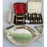 An Asprey hallmarked silver fruit dish together with a pair of hallmarked knife rests,