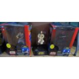 A collection of three Star Wars figures consisting of Obi Wan-Kenobi, Darth Maul, Qui-Gon Jinn.