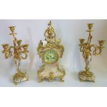 An early 20th century gilt metal and veined marble clock garniture with recocco decoration.