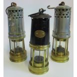 Three vintage miners lamps
