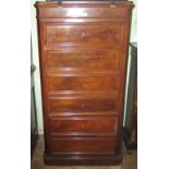 A Victorian mahogany tall cupboard in the form of a Wellington chest with cupboard door over two