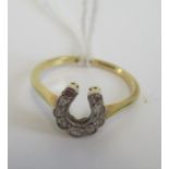 A 18ct gold and diamond horseshoe ring. Condition Report: Weight = 2.