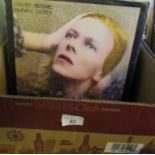Two boxes containing a large quantity of vinyl LP's to include David Bowie, Santana, Carole King,