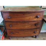 A Victorian bow front chest of three long graduated draws.