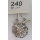 A late Victorian diamond cluster pendant cum brooch,