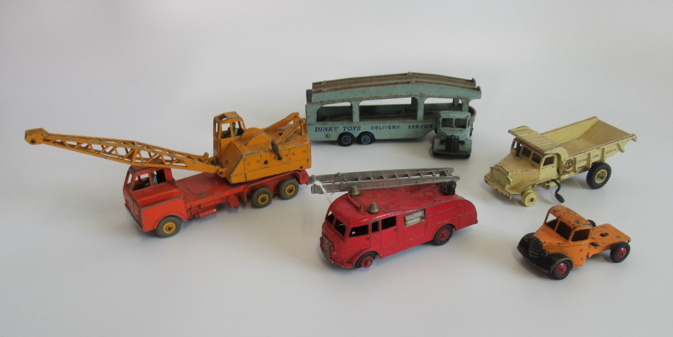 A collection of five miscellaneous play-worn Dinky toys, to include: dump truck, fire engine,