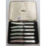 A cased set of hallmarked silver and mother of pearl handled fruit knives.